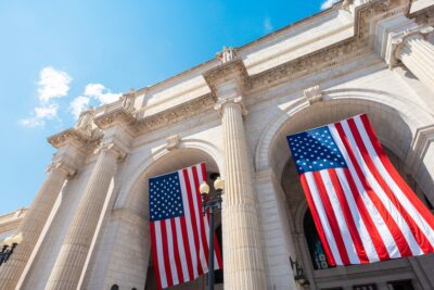 Two American flags hanging inside Union Station arches, Washington DC