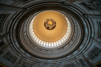 Interior rotunda dome of the US Capitol looking straight up at the painted ceiling